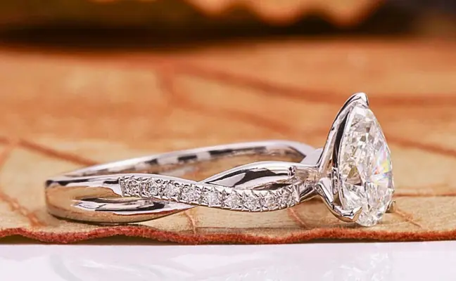 Pear Cut Lab Grown Diamond Engagement Ring With Twisted Pave Band