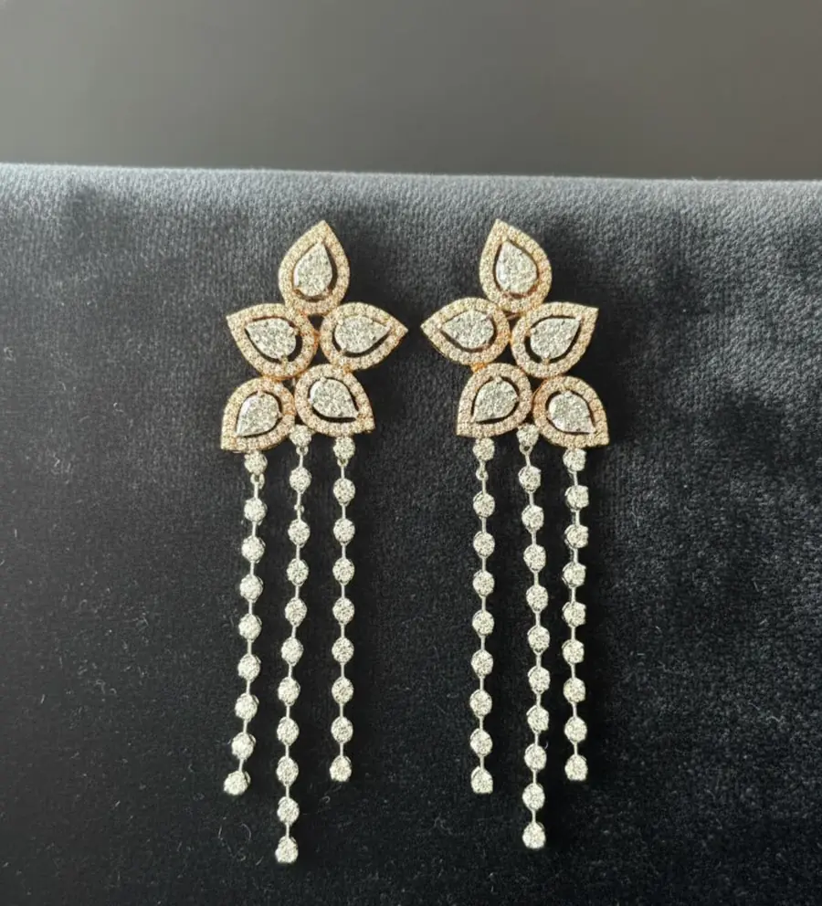 Multi-layered long necklace and matching floral chandelier earrings.
