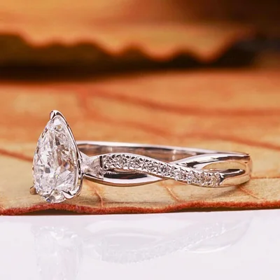 Pear Cut Lab Grown Diamond Engagement Ring With Twisted Pave Band