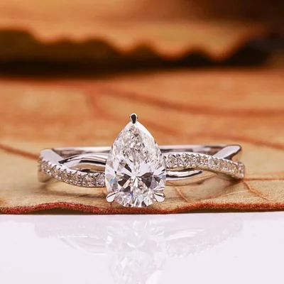 Pear Cut Lab Grown Diamond Engagement Ring With Twisted Pave Band
