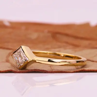 East-West Lozenge Cut Lab Grown Diamond Solitaire Ring in Bezel Setting