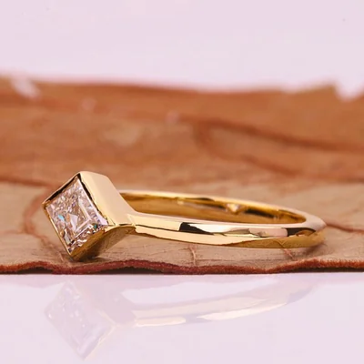 East-West Lozenge Cut Lab Grown Diamond Solitaire Ring in Bezel Setting