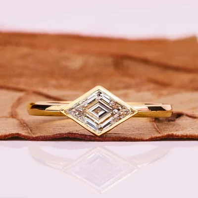 East-West Lozenge Cut Lab Grown Diamond Solitaire Ring in Bezel Setting