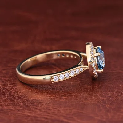 Blue Round Cut Lab Grown Diamond Halo Engagement Ring with Pave Band