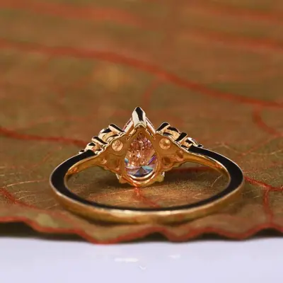 Orange Pear Cut Lab Grown Diamond Ring with Round Side Diamonds